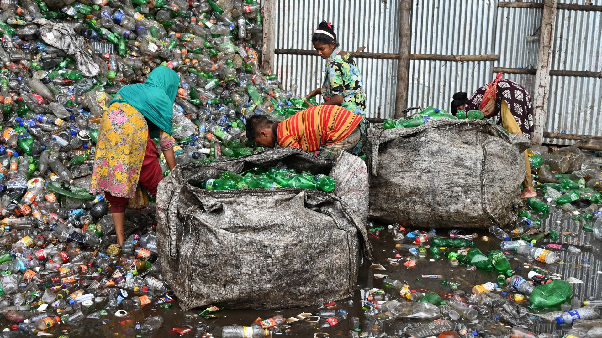 People sorting through limited recyclable resources